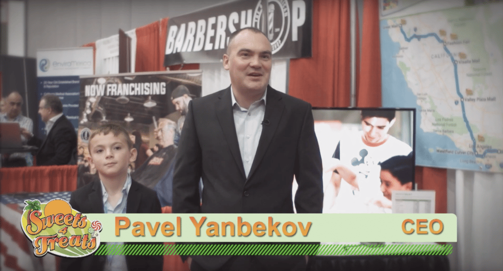 Pavel Yakovlev, CEO, showcasing at a trade show with testimonials.
