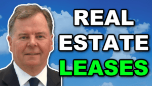 A man in a suit and tie proficient in negotiating real estate leases.