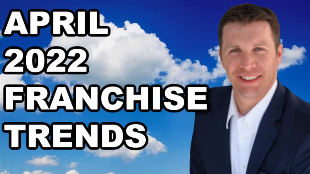 A man in a suit presenting the April 2020 franchise trends.