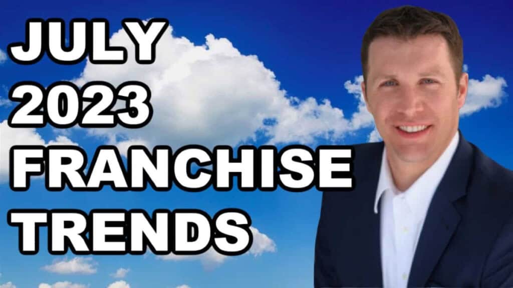 A professional man in a suit against a sky background with clouds.