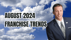 A professional man in a suit alongside bold text reading "August 2024 Franchise Trends" against a sky background with clouds.